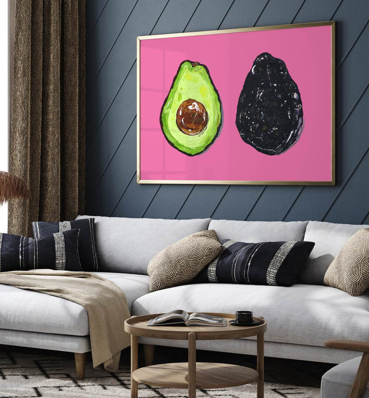 Avocado on Pink by Alice Straker Kitchen Posters Kitchen Art Prints in Gold Plain Frame placed on a living room wall behind a sofa