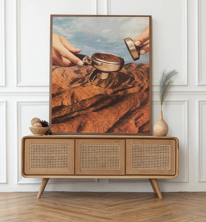 Barista Coffee County Surreal Art Painting Artwork in plain oakwood frame on a console table beside a flower pot