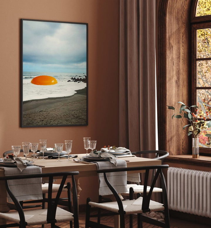 Beach Egg - Sunny Side Up Surreal Painting, Surreal Art Artwork in Black Plain Frame placed on a Brown Wall near a Dining Table in the Dining Room