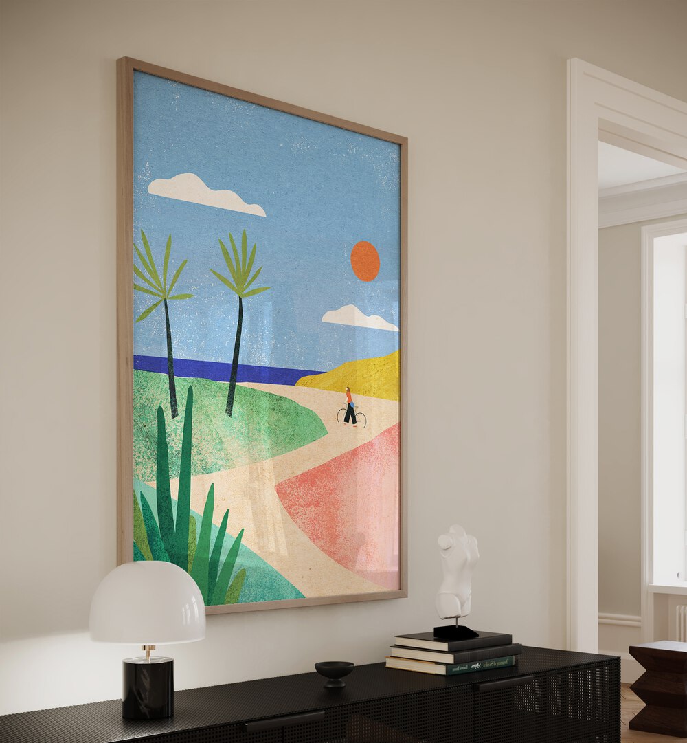 Beach Girl Landscape Art Artwork in Oak Wood Plain Frame Placed on a Cream Colored Wall above a Black Console Table