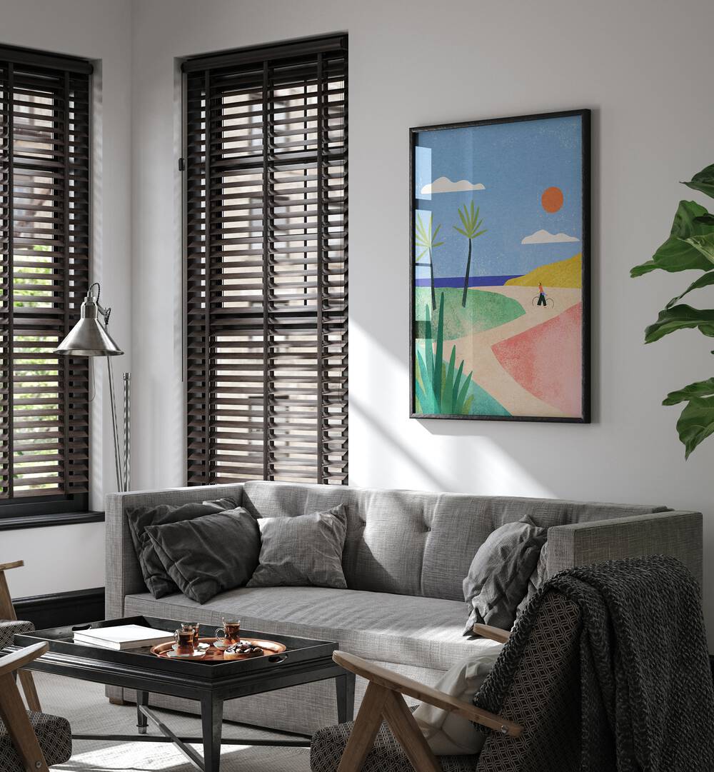 Beach Girl Landscape Art Artwork in Black Plain Frame Placed on a White Wall behind a Grey Sofa in the Living Room