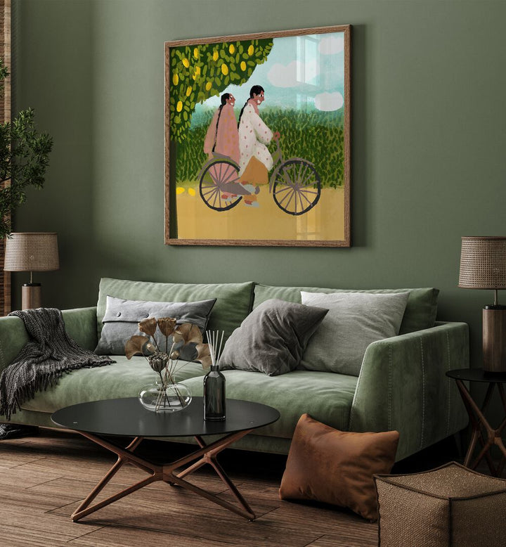 Bicycle Ride By Shreya Roy Chowdary, Indian Art Paintings Artwork in Oak Wood Plain Frame placed on a Green Colored Wall near a Green Sofa in the Living Room