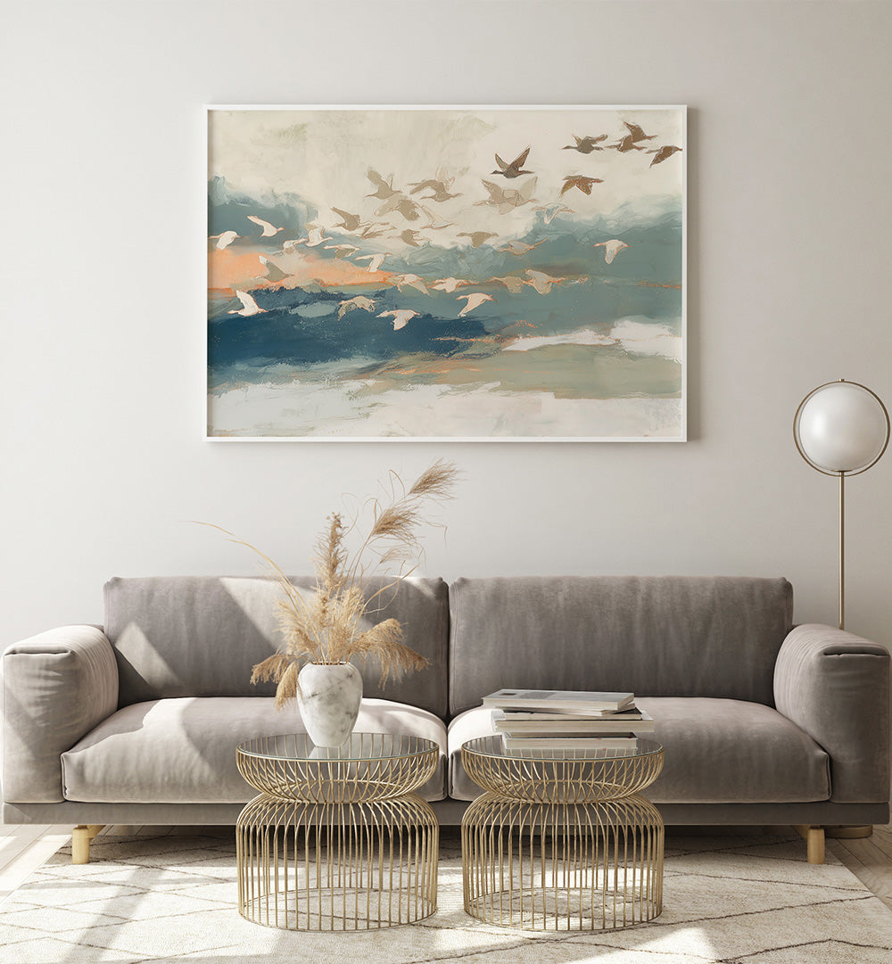 BIRDS IN FLIGHT AT DUSK OVER OPEN WATER