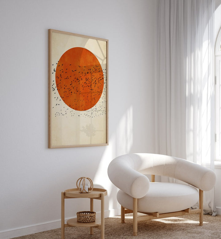 Birds In The Sun Landscape Art Artwork in Oak Wood Plain Frame placed on a Cream Colored Wall near a White Sofa Chair in the Drawing Room