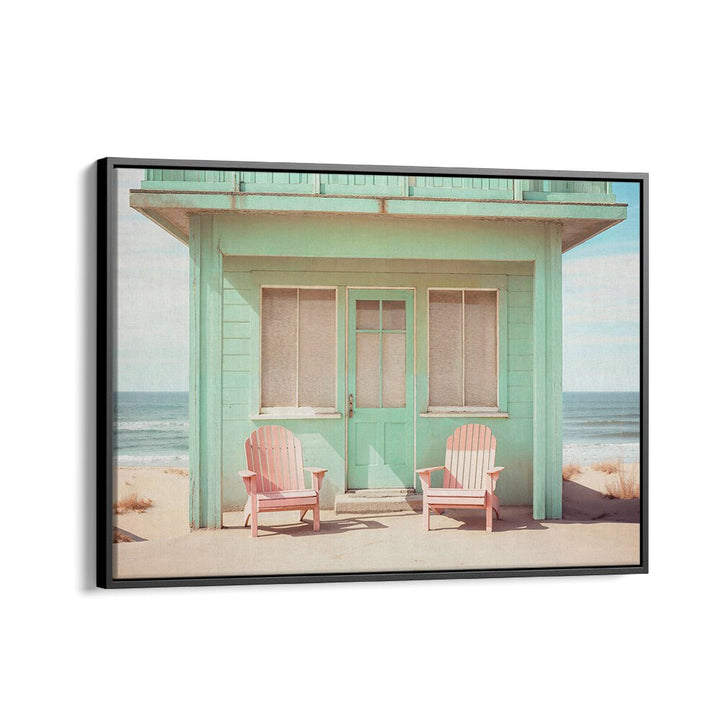 Pastel Perspectives, beach paintings featuring a charming teal cottage and pink chairs, embodying serene coastal beauty.