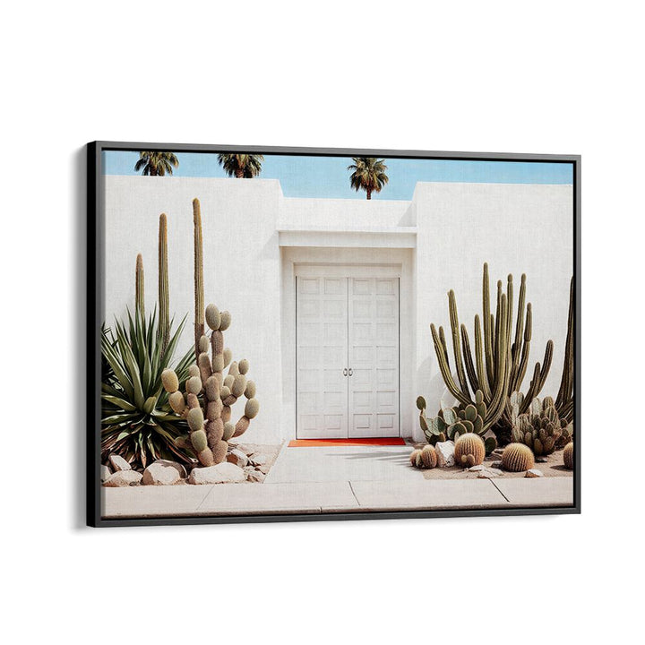 Elegant WHITE MID-CENTURY MODERN HOUSE with beach paintings and lush cacti, perfect for modern decor.