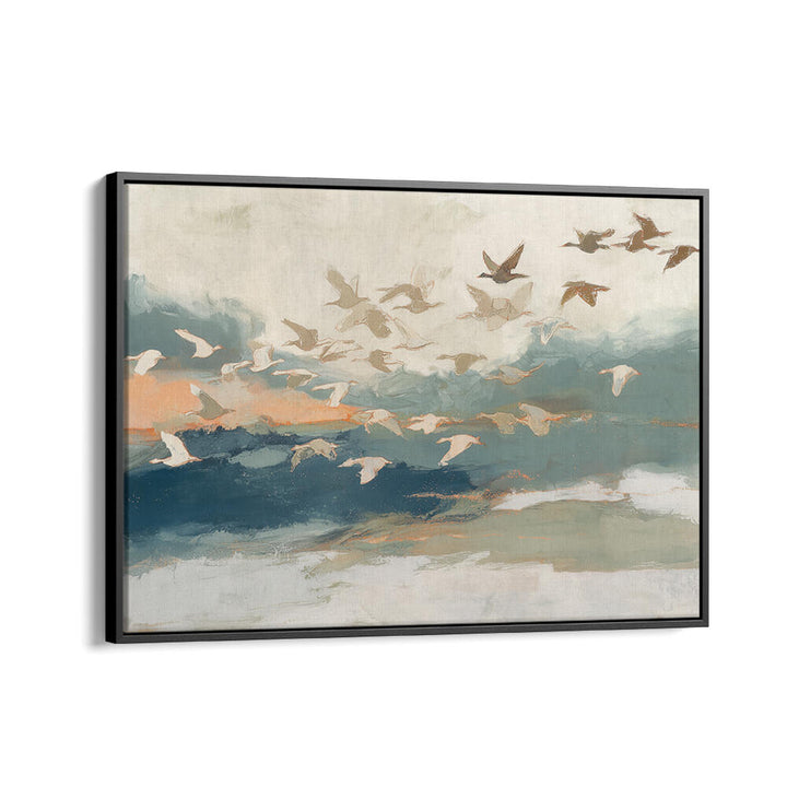 BIRDS IN FLIGHT AT DUSK OVER OPEN WATER