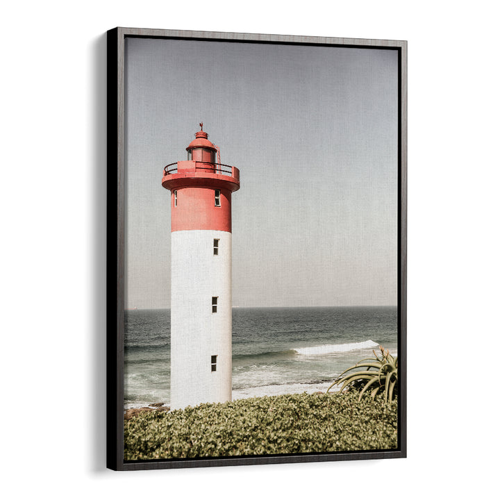 BEACON BY THE SEA , BEACH PAINTINGS framed BlackFloater print of a red-topped lighthouse overlooking the sea and coastal foliage