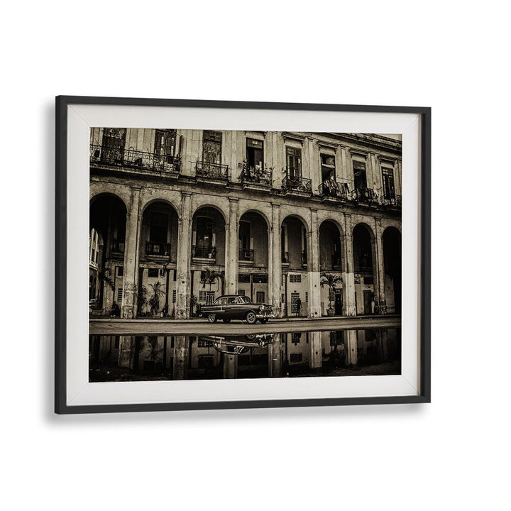 Explore urban elegance with HABANA STREET VIII, PHOTOGRAPHY PRINTS, showcasing iconic architecture and vintage cars.