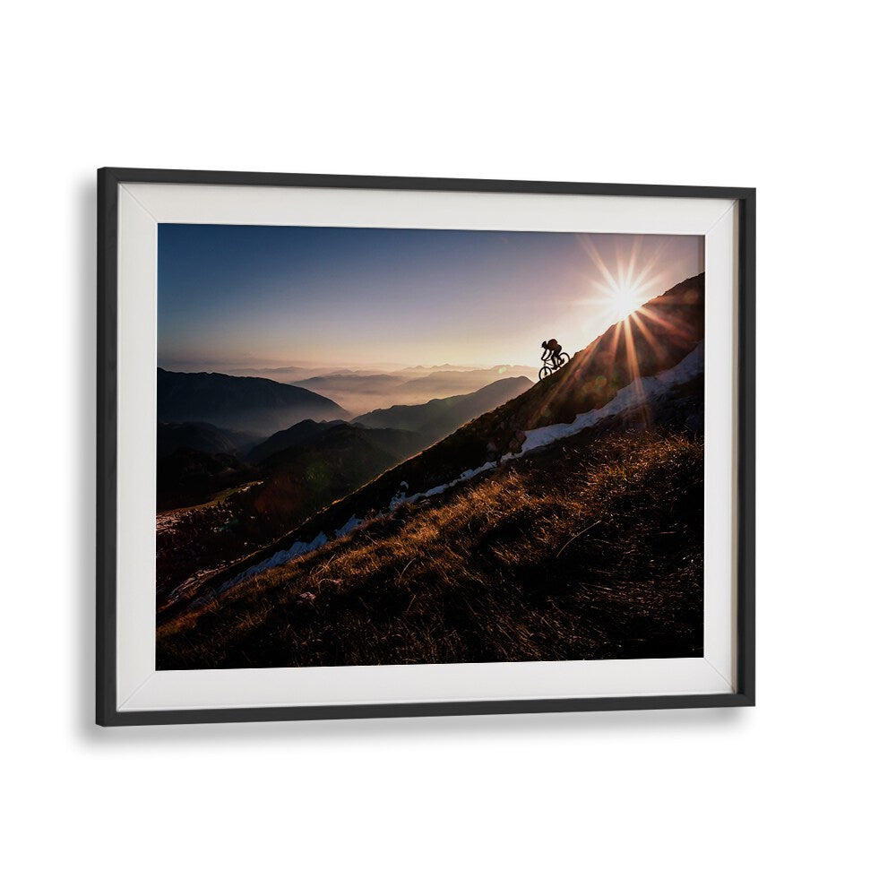 Breathtaking LAST RAYS, PHOTOGRAPHY PRINTS showcasing a cyclist against a stunning sunset backdrop in fine art style.