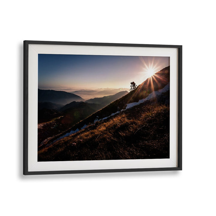 Breathtaking LAST RAYS, PHOTOGRAPHY PRINTS showcasing a cyclist against a stunning sunset backdrop in fine art style.