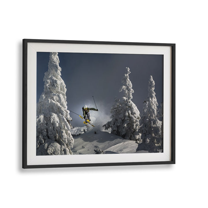 Dynamic skier jumping through snowy trees in the SKI IS LIFE, PHOTOGRAPHY PRINTS collection, capturing winter's thrill.
