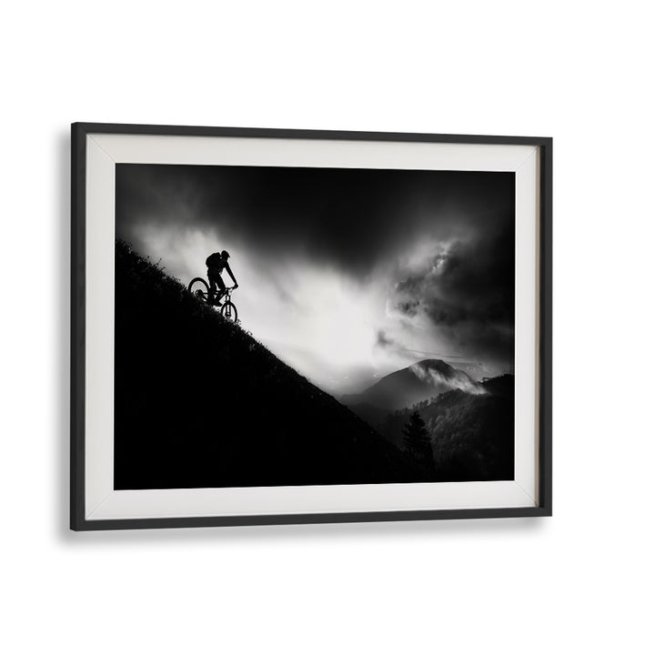 Stunning black and white depiction of a cyclist at dawn, part of the SUNRISE RIDE, PHOTOGRAPHY PRINTS collection.