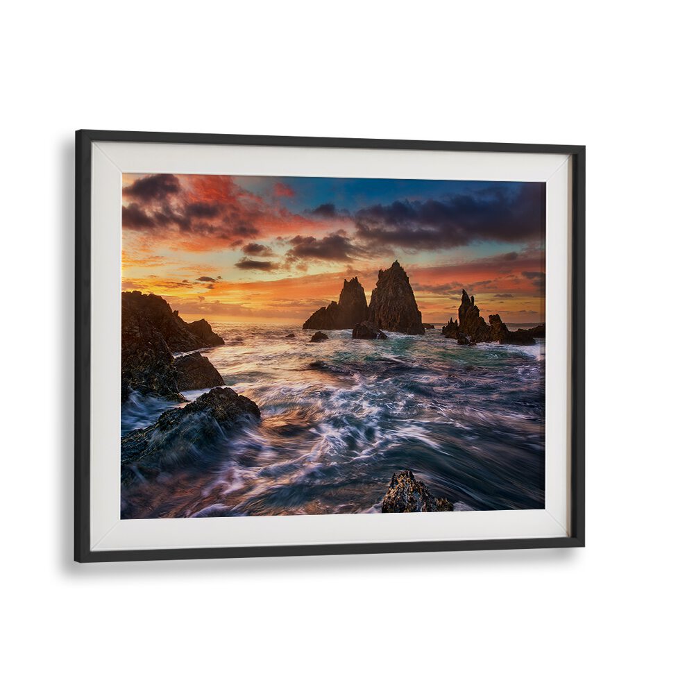 Stunning sunset over rocky coastline captured in DANCE WITH LIGHT, PHOTOGRAPHY PRINTS to illuminate your space.