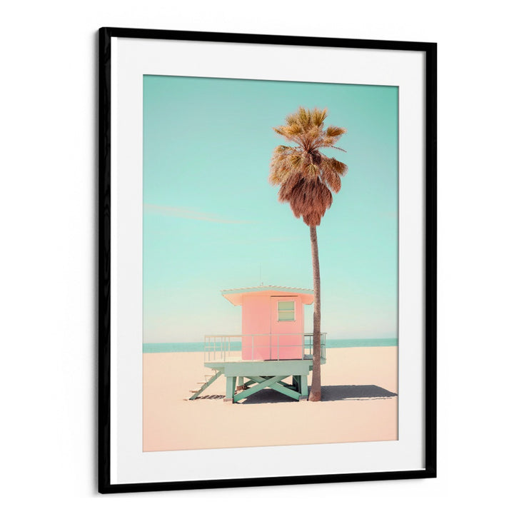 BEACHSIDE PINK BLISS, BEACH PAINTINGS features a pastel lifeguard tower and palm tree, capturing coastal tranquility.