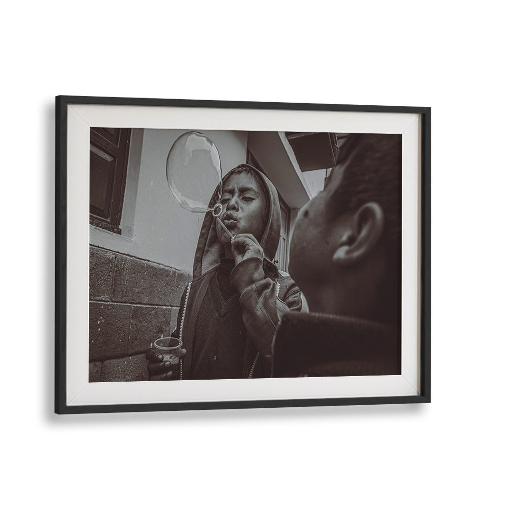 A boy blowing bubbles captures the essence of urban life in CUSCO STREET, PHOTOGRAPHY PRINTS for art lovers.