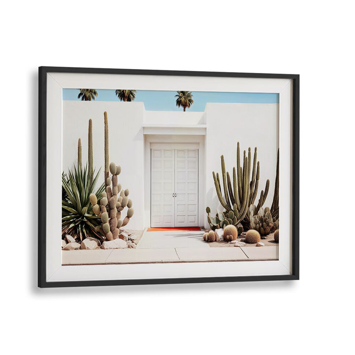 Elegant WHITE MID-CENTURY MODERN HOUSE with beach paintings and desert plants, perfect for modern decor enthusiasts.