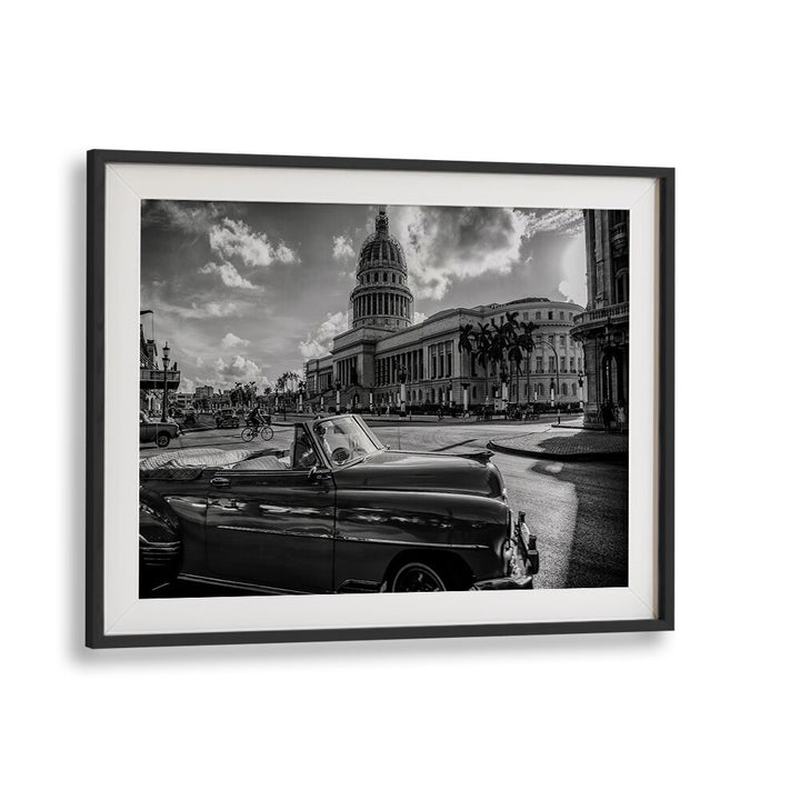 EL CAPITOLIO, PHOTOGRAPHY PRINTS showcases a classic car against a stunning urban backdrop, capturing vibrant city life.