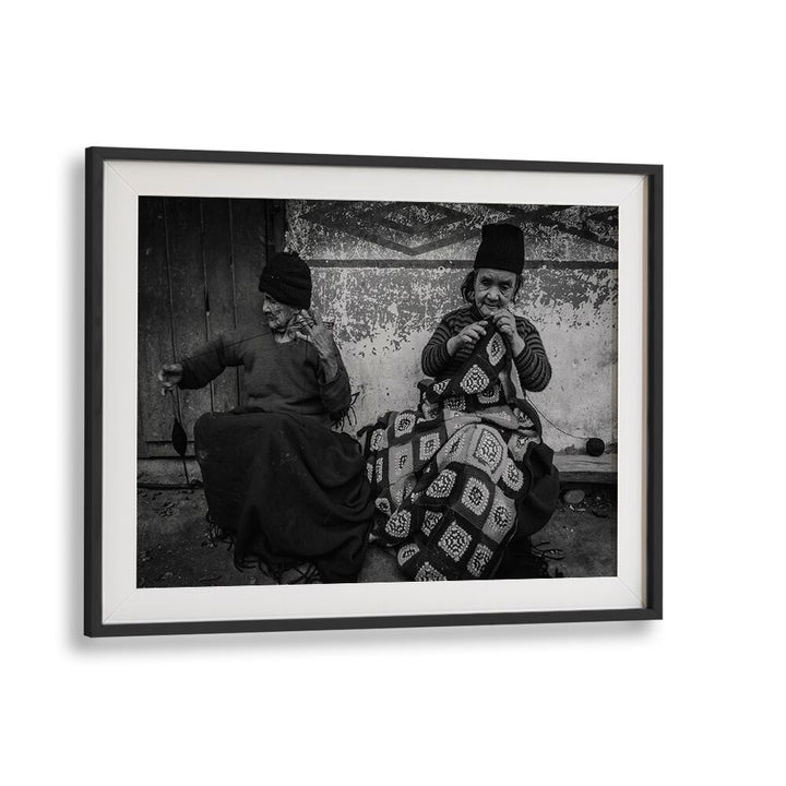 Two elderly women knitting together, showcasing connection in "KNITTING SISTERS, PHOTOGRAPHY PRINTS" collection.