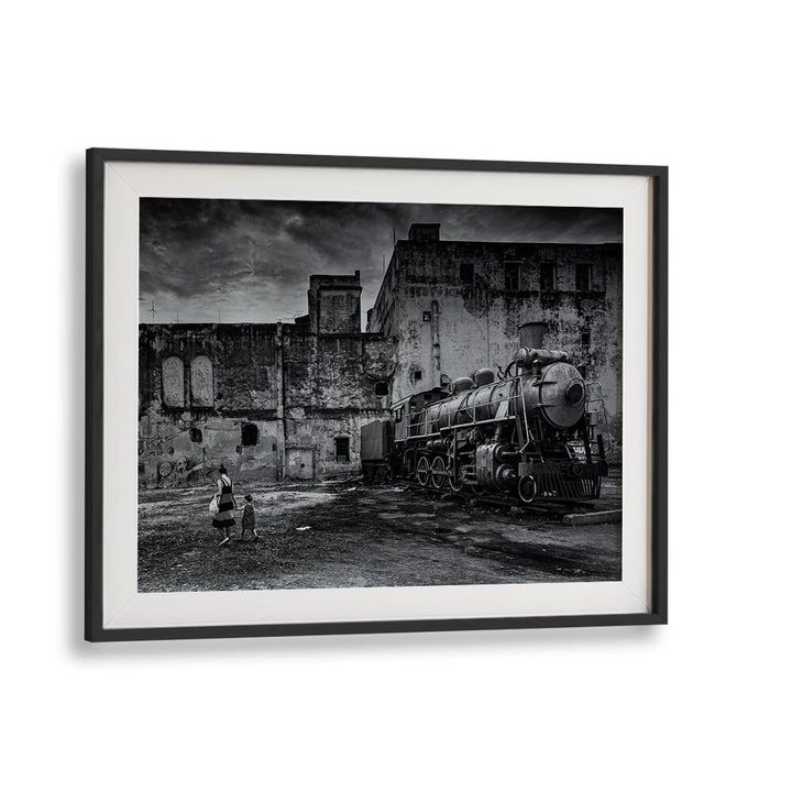 Black and white TRAIN, PHOTOGRAPHY PRINTS showcasing a vintage locomotive in an urban setting. Perfect for art lovers.