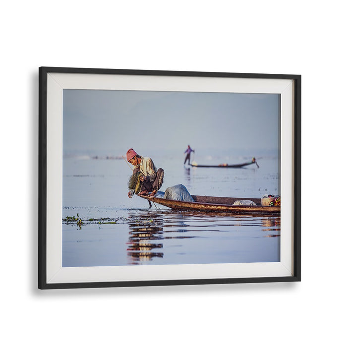 Fishermen at sunrise create a serene scene in this captivating photography print, perfect for tranquil decor.