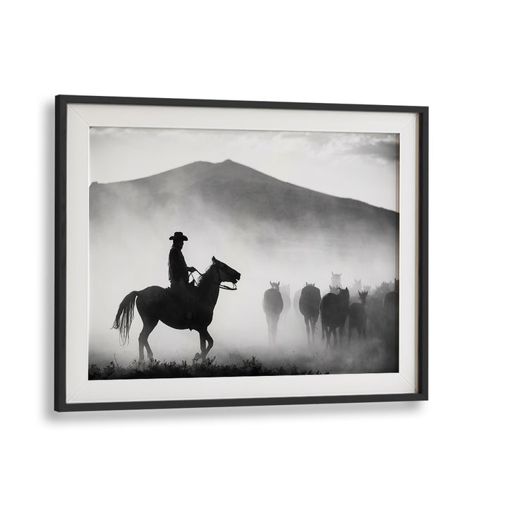 Silhouetted cowboy leading horses through misty landscapes in "HIS TERRITORY! , PHOTOGRAPHY PRINTS" collection.