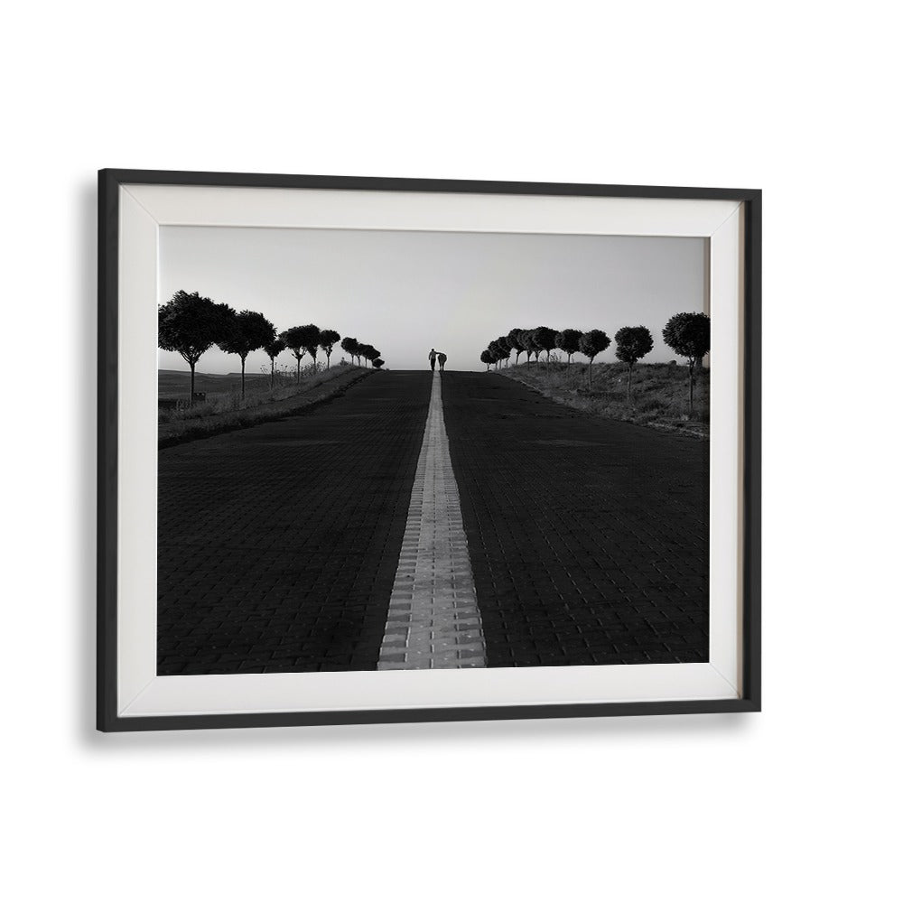 Capture the essence of urban life with GOING HOME, PHOTOGRAPHY PRINTS, featuring a couple on a serene path.