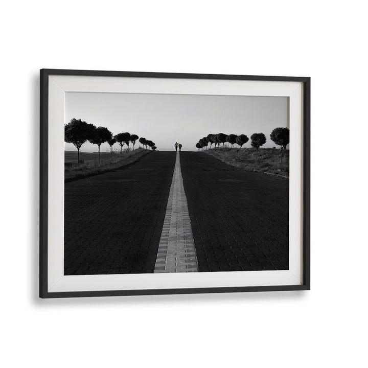 Capture the essence of urban life with GOING HOME, PHOTOGRAPHY PRINTS, featuring a couple on a serene path.