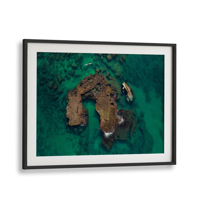 Stunning aerial view of a kayak exploring shipwrecks, perfect for KAYAK WRECK EXPLORATION, PHOTOGRAPHY PRINTS.