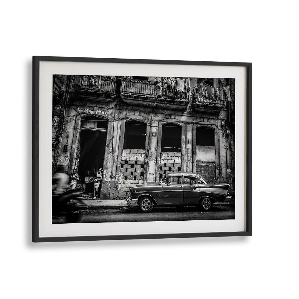HABANA STREET IN BLACK AND WHITE I, PHOTOGRAPHY PRINTS showcases urban life with a vintage car against textured buildings.