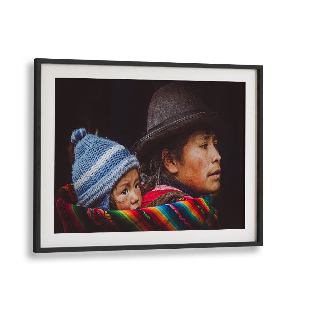 Celebrate urban life with CUSCO STREET II, PHOTOGRAPHY PRINTS, showcasing a poignant family moment in vibrant detail.