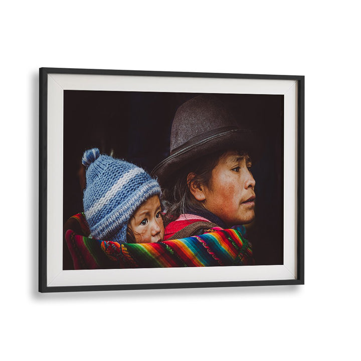 Celebrate urban life with CUSCO STREET II, PHOTOGRAPHY PRINTS, showcasing a poignant family moment in vibrant detail.