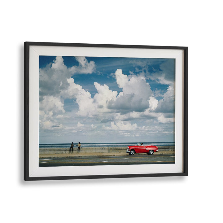 Explore urban life with MALECON VIII, PHOTOGRAPHY PRINTS featuring a vibrant scene of street moments and classic cars.