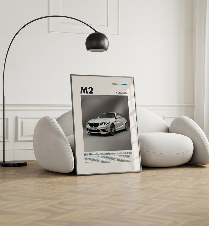 BMW M2 Competition Car Posters Automotive Wall Art Prints in Black Plain Frame placed on the floor near a White Sofa in the Living Room