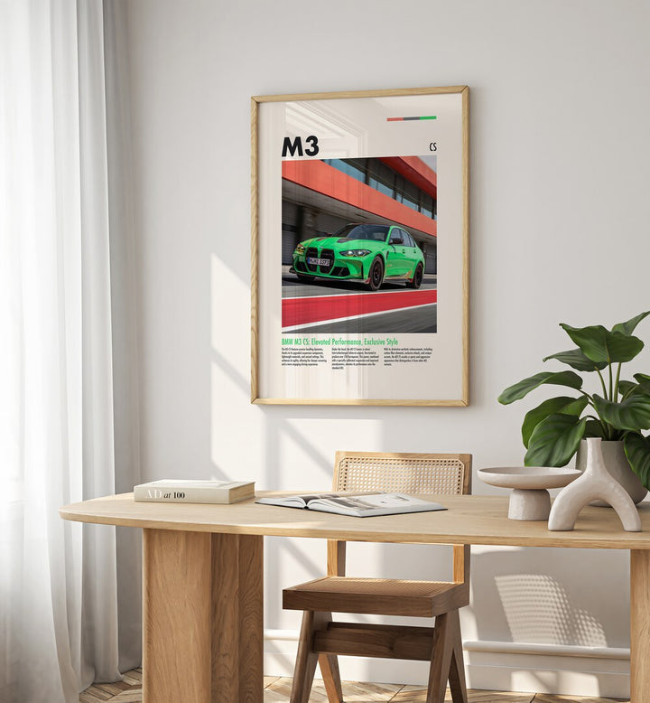 BMW M3 CS Car Posters Automotive Wall Art Prints in Oak Wood Plain Frame placed on a White  Colored Wall near a Study Table in a Workspace in the Drawing Room