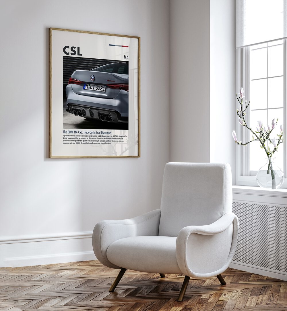 BMW M4 CSL IV Car Posters Automotive Wall Art Prints in Oak Wood Plain Frame placed on a White Colored Wall near a White Sofa Chair in the Drawing Room