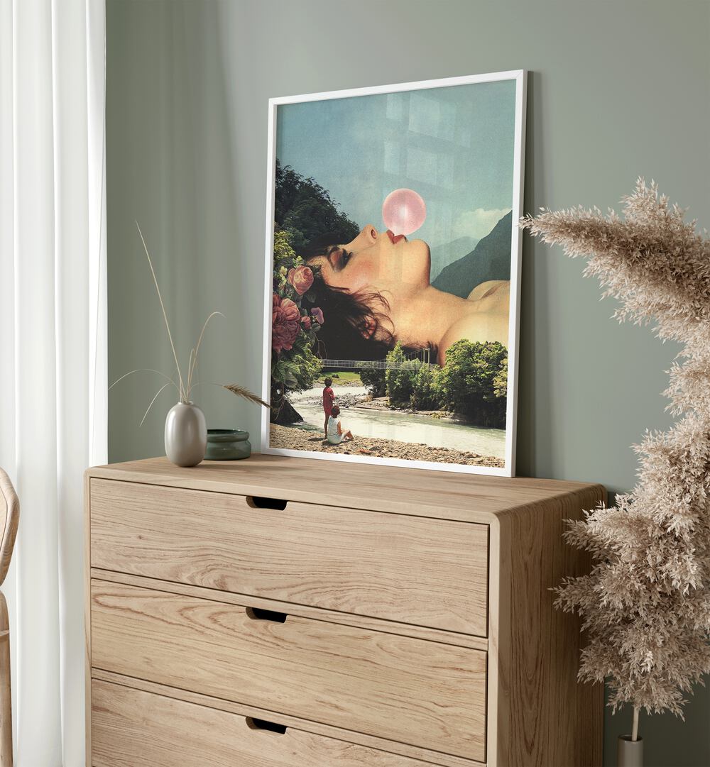 Bubble Gum Girl Surreal Art Painting Artwork in plain white frame above a console table beside an artificial plant