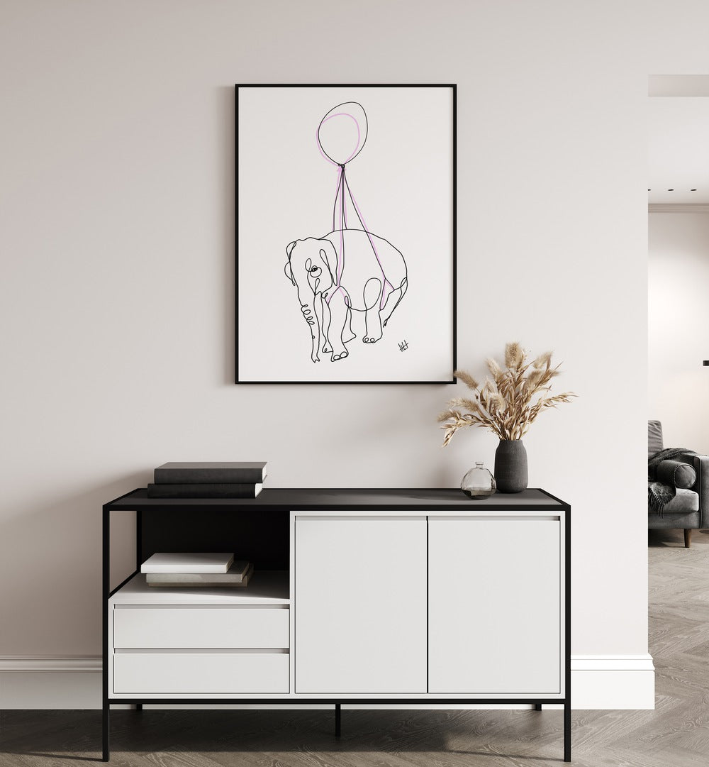 Baby Float by Hanna Lee Tidd Line Art Paintings Line Art Prints in Black Plain Frame placed on a wall behind a table