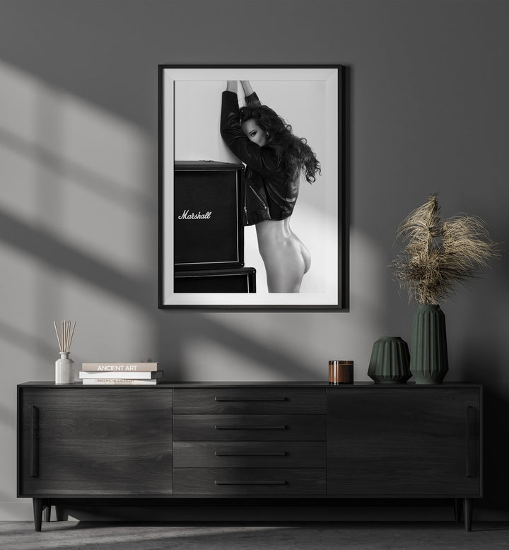 Baby by David Drake Fine Art Photography Fashion Photography in Black Frame With Mount placed on a wall behind a console table