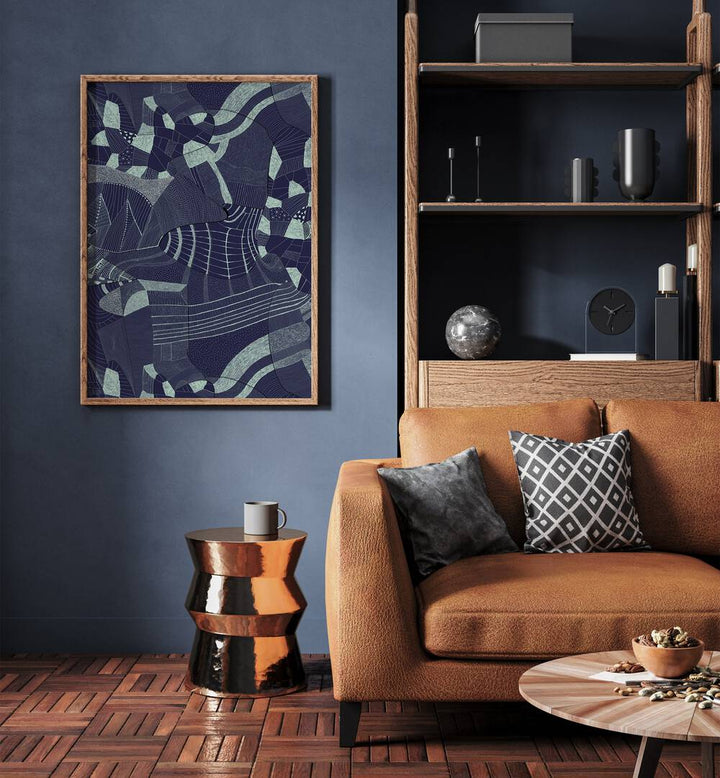 Bakiro Abstract Art Abstract Paintings in Oak Wood Plain Frame placed on a Blue Colored Wall near a Brown Sofa in the Living Room