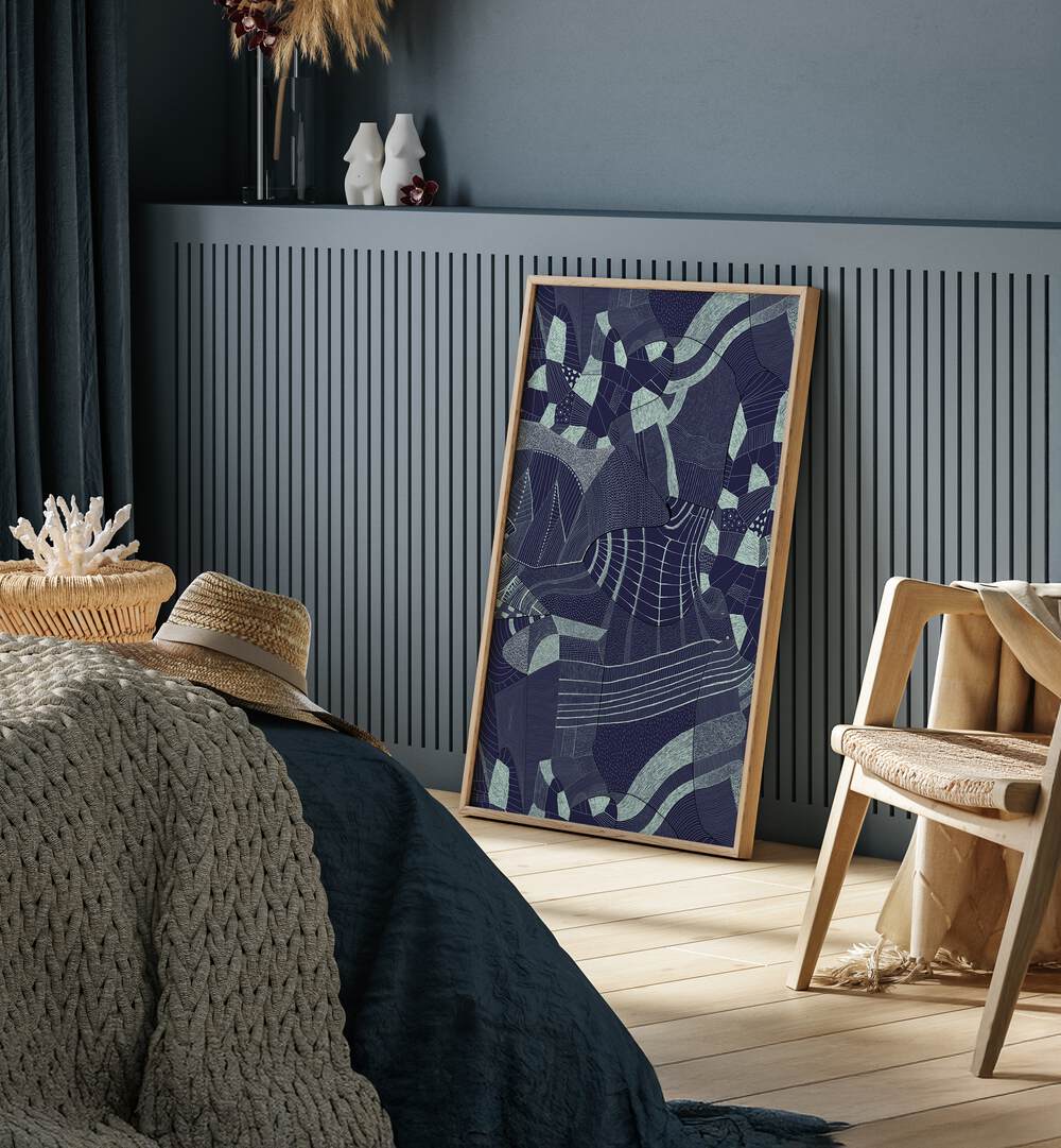 Bakiro Abstract Art Abstract Paintings in Oak Wood Plain Frame placed on the floor near a Blue Colored Wall near a Bed in the Bedroom