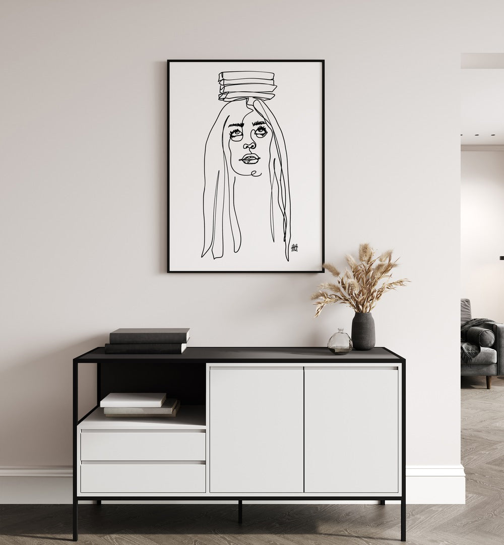 Balancing Act I by Hanna Lee Tidd Line Art Paintings Line Art Prints in Black Plain Frame placed on a wall behind a white and black console table