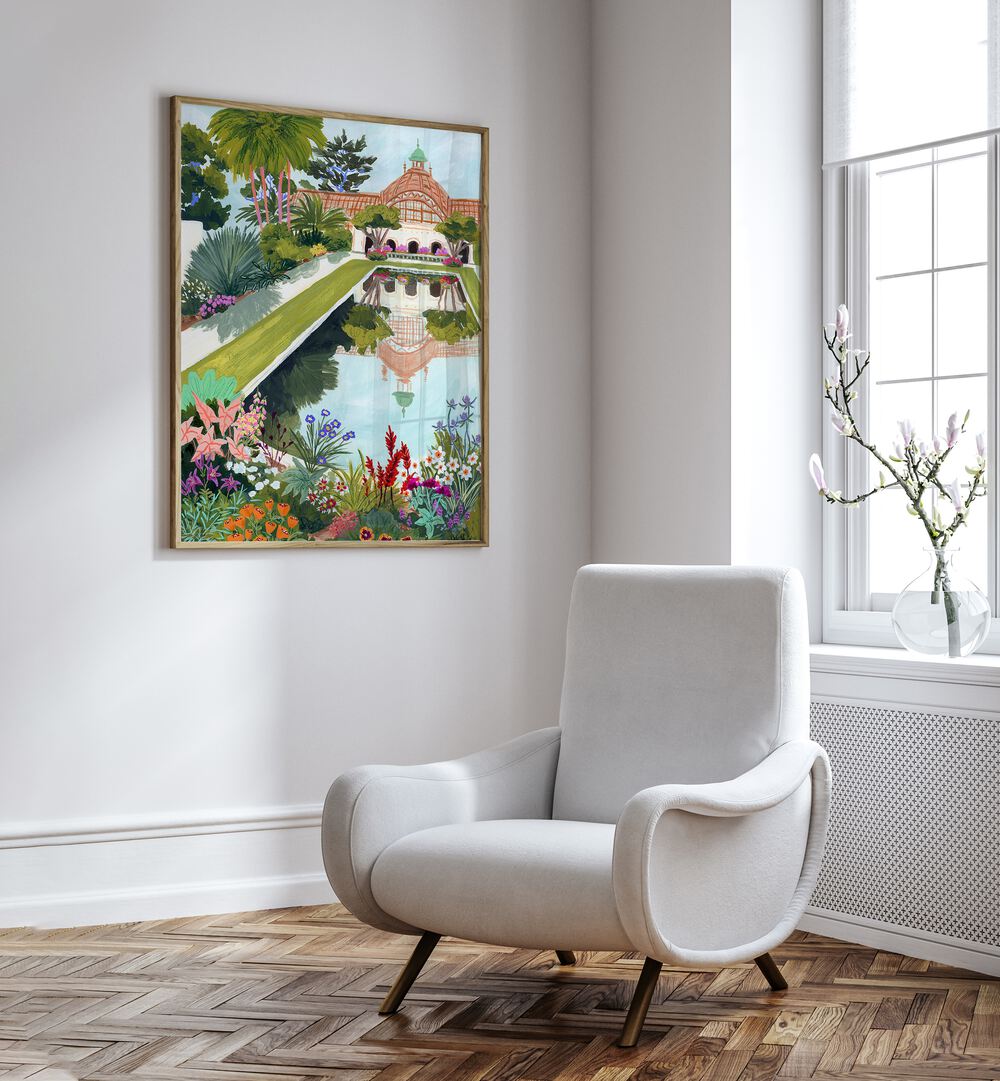 Balboa Park By Sarah Gesek Wall Art Prints in Oak Wood Plain Frame placed on a white wall beside a white chair and a window