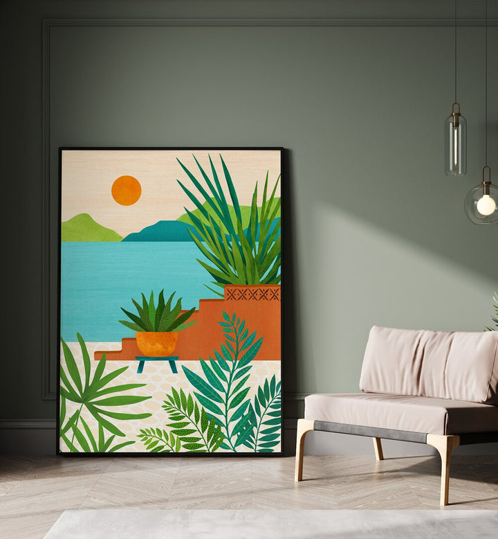 Bali Coast Sunset by Kristian Gallagher Botanical Flower Paintings Floral Paintings in Black Plain Frame placed on the floor beside a sofa