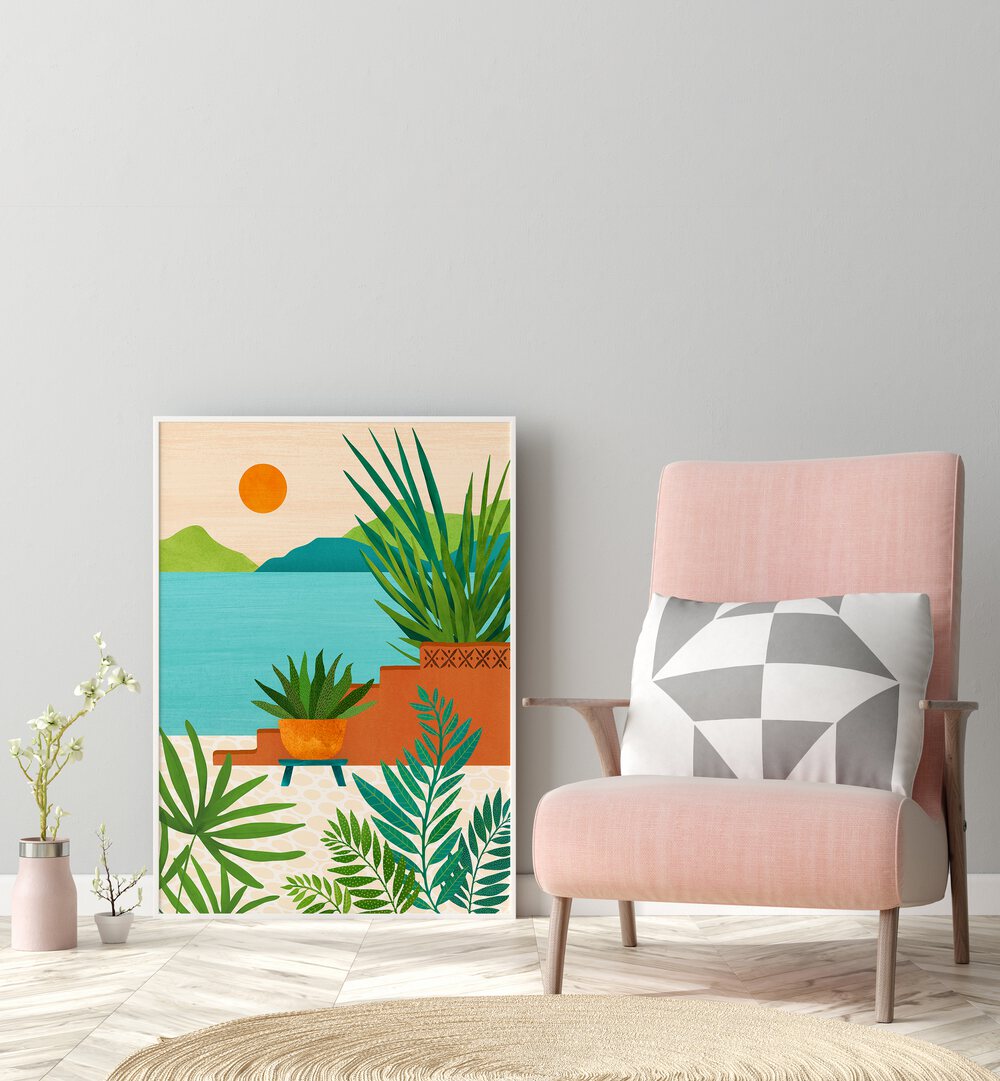 Bali Coast Sunset by Kristian Gallagher Botanical Flower Paintings Floral Paintings in White Plain Frame placed on the floor beside a chair