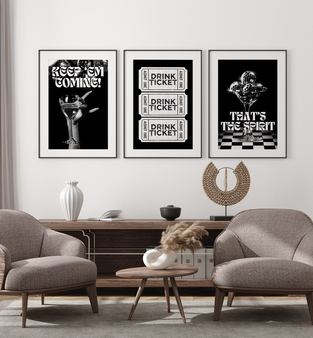 Bar Set Set Of 3 Paintings in Black Frame With Mount placed on a wall behind a console table and chairs