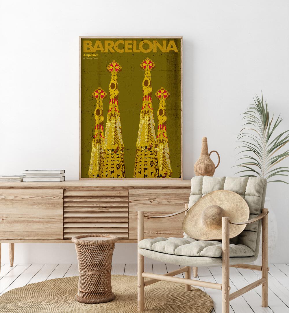 Barcelona-espana  Travel Posters in Oak Wood Plain Frame placed on a console table behind a chair