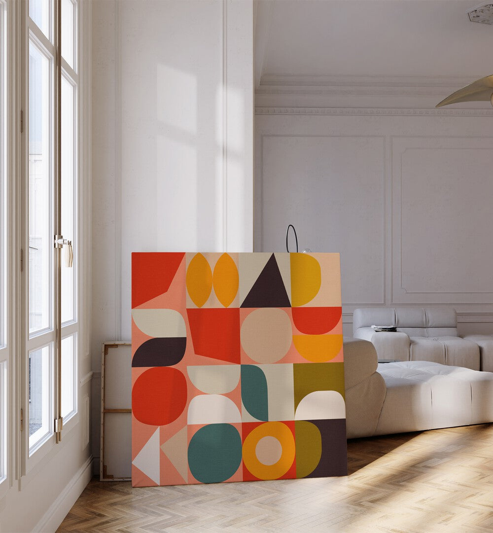 Bauhaus New IV By Ana Rut Bre Abstract Art Abstract Paintings in Gallery Wrap placed on the floor near a White Sofa in the Living Room