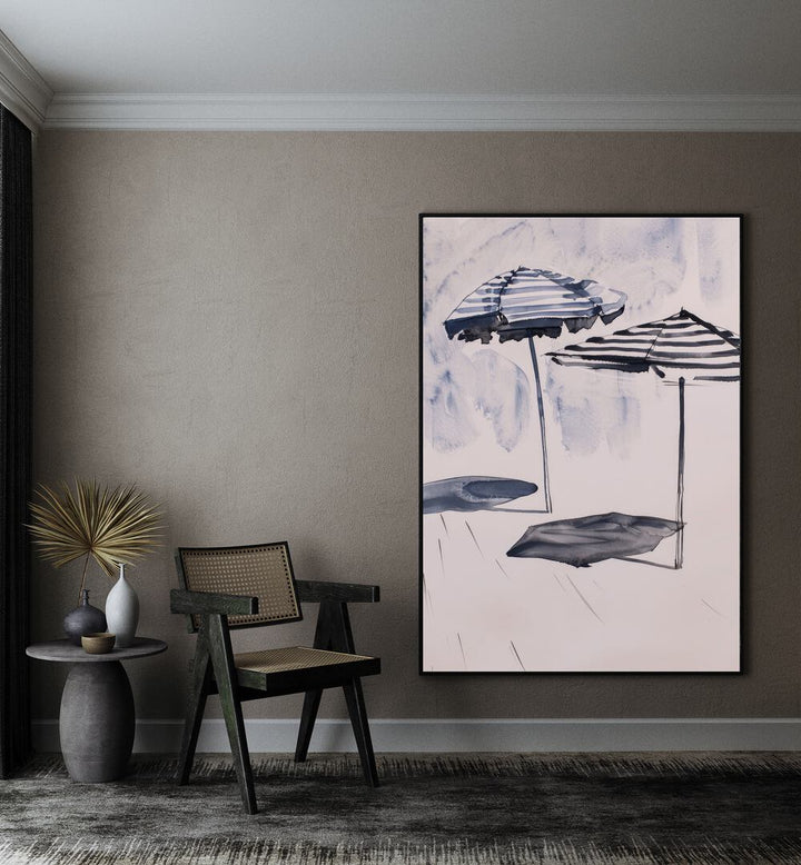 Beach Breeze Canopy Beach Prints Coastal Wall Art in Black Plain Frame placed on a wall beside a chair