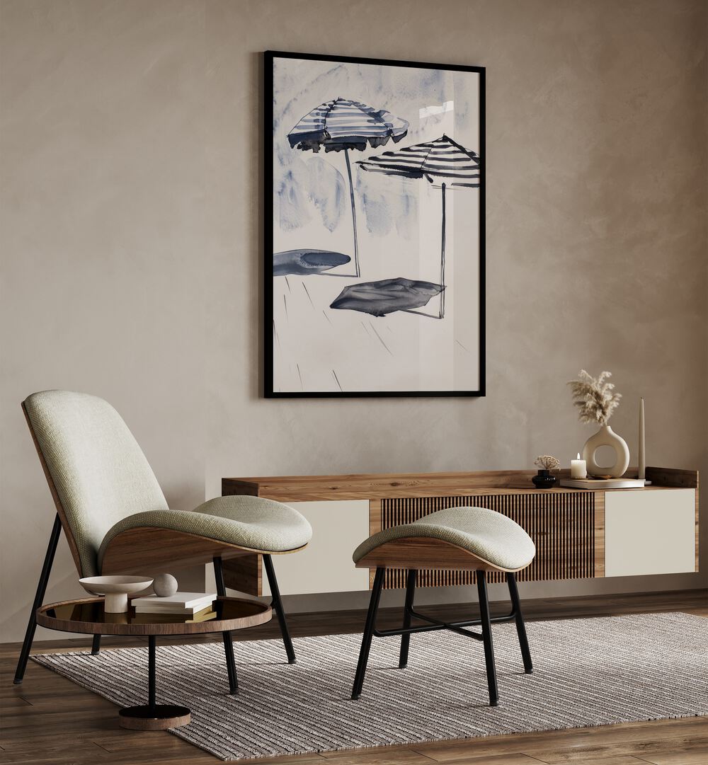 Beach Breeze Canopy Beach Prints Coastal Wall Art in Black Plain Frame placed on a wall behind a console table and beside a chair